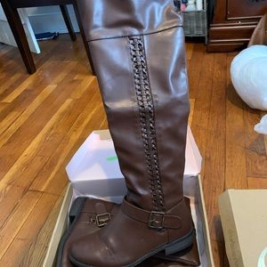 High boots , right below knee cap